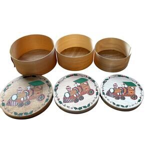 3 Nesting wooden boxes with Christmas train on top